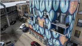 Artist Sick Fisher goes big with murals visible from the L in Rogers Park and Logan Square